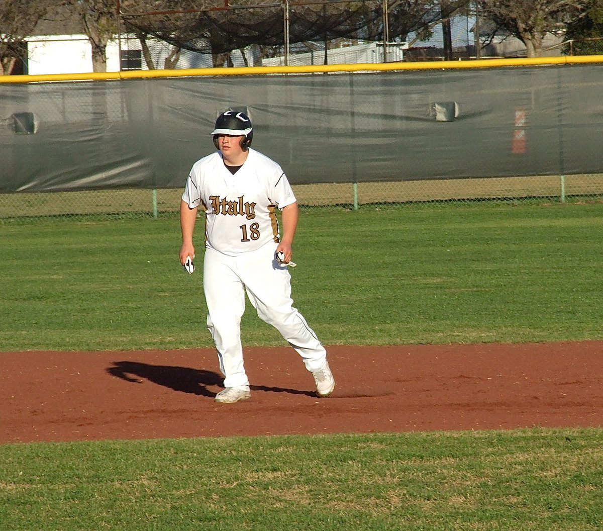 Image: John Byers(18) gets a big lead from second-base against Itasca.