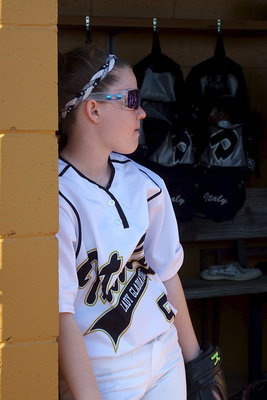 Image: Lady Gladiator Tara Wallis(5) holds up the dugout while waiting for the fun to start.