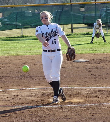 Image: Jaclynn Lewis(15) gave a dominant performance while pitching a perfect game against Avalon to help Italy improve to 4-0 in district play. Teammate Kelsey Nelson(14) backs up Lewis from centerfield.