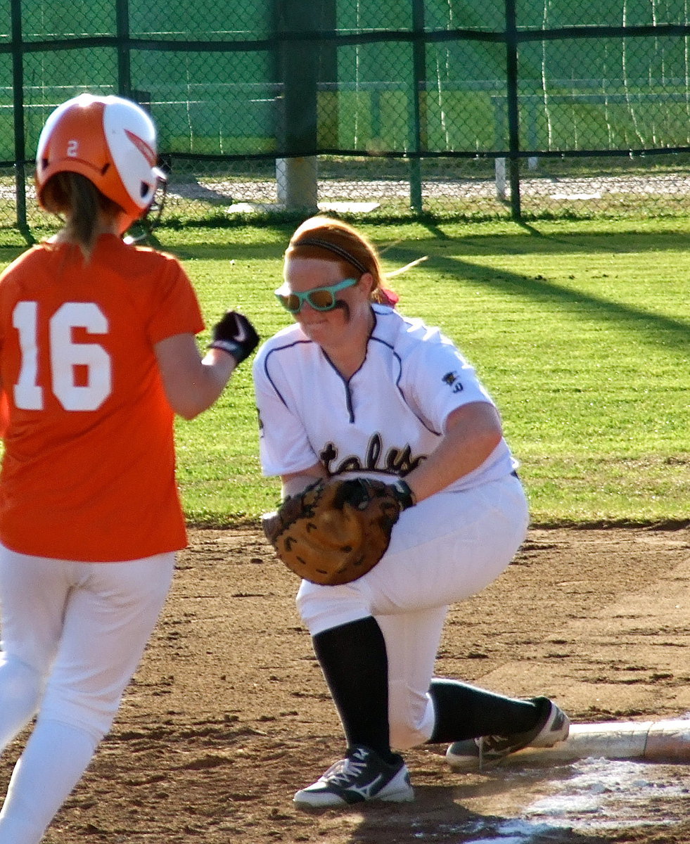 Image: Katie Byers(13) manages to control a throw to first base for another Italy out.