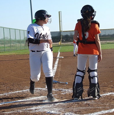 Image: Alyssa Richards(9) stomps home plate for another Italy run.