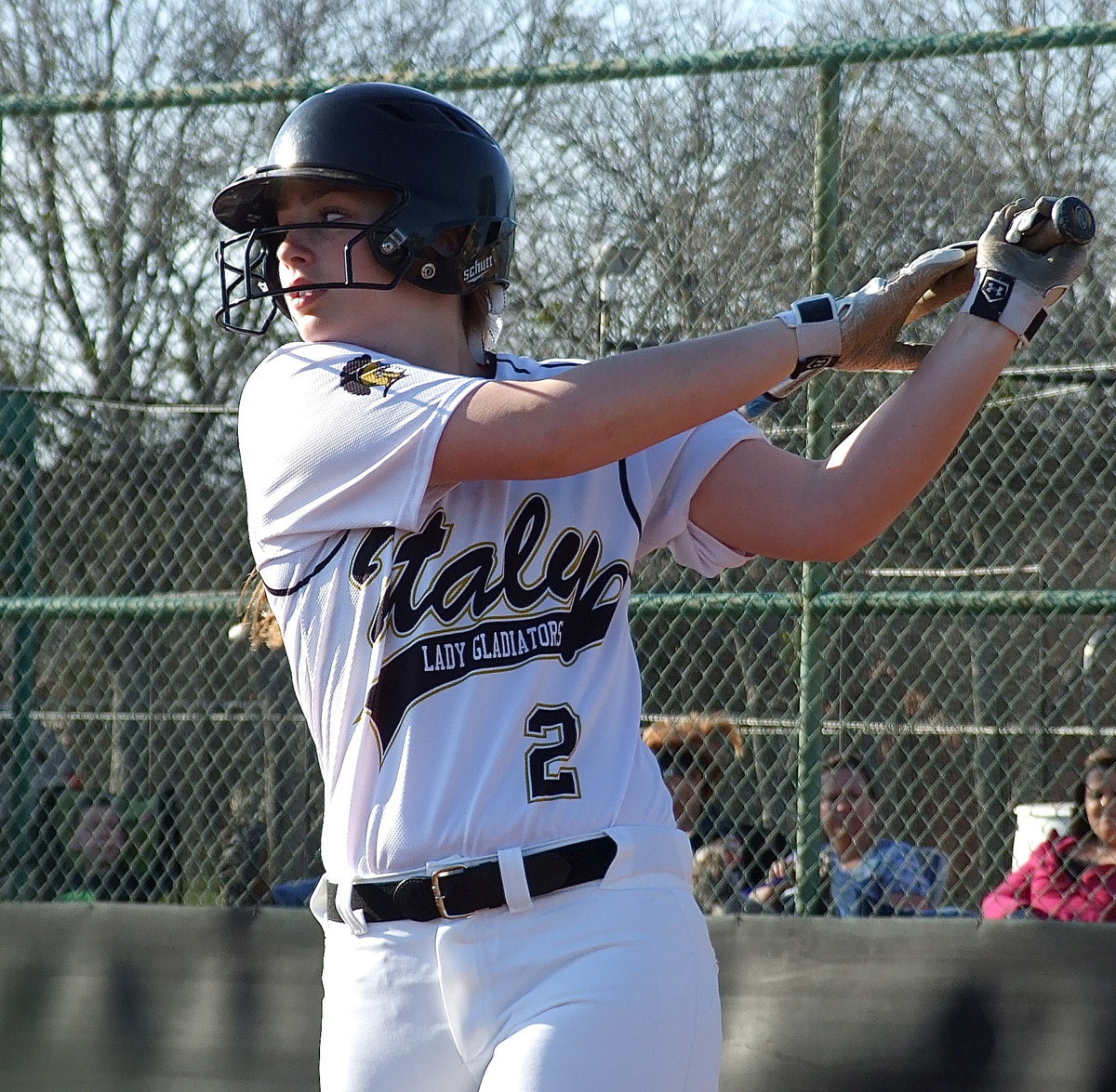 Image: Italy’s Madison Washington(2) takes a practice swing before stepping up to the plate.