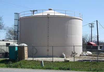 Image: The previously constructed steel tank located behind Harris’ Body Shop.