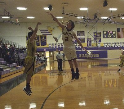 Image: Italy’s Reid Jacinto(5), a senior, lets a 3-pointer fly from the right corner against Collinsville.