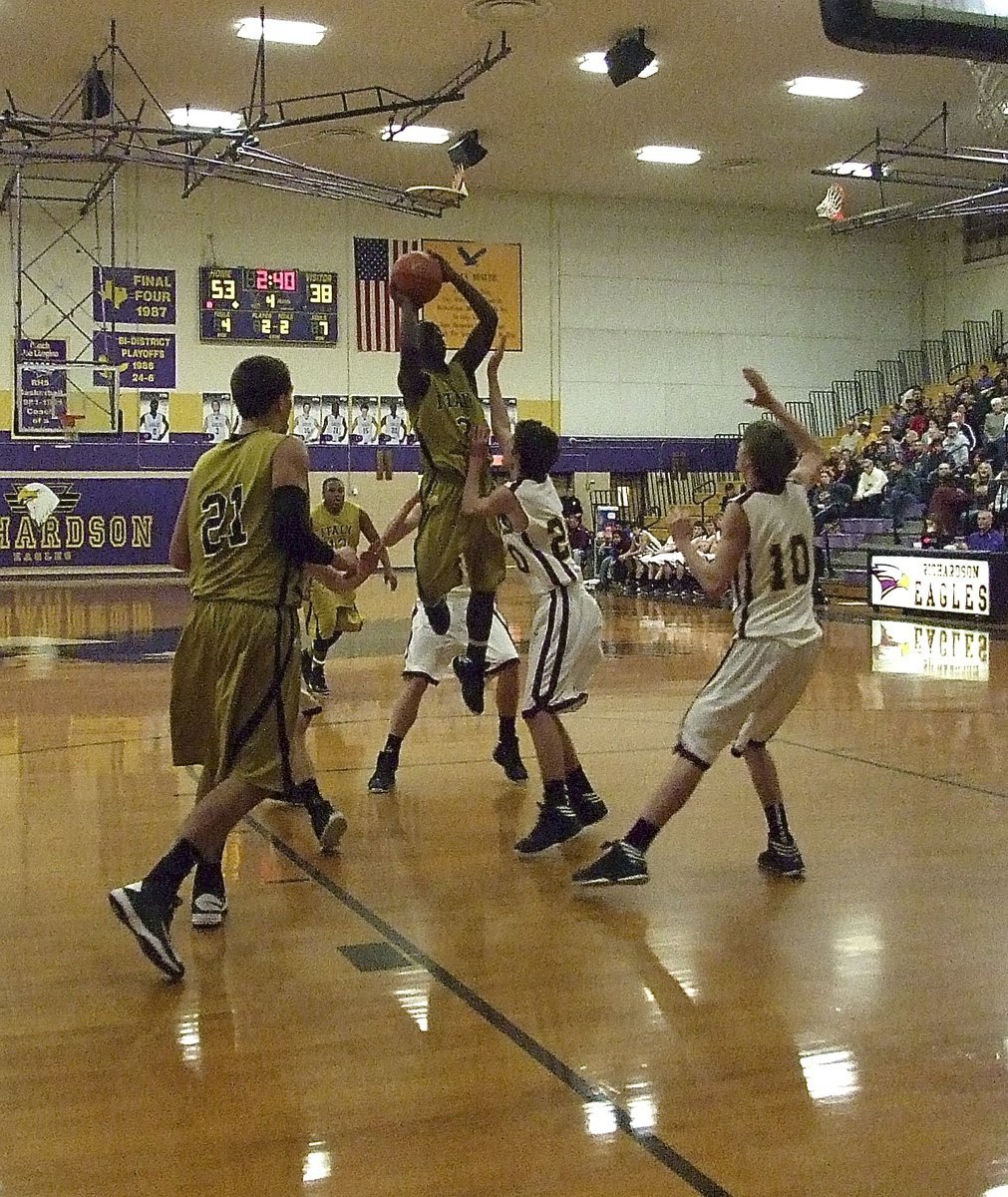 Image: Marvin Cox(3) rises in traffic with Cole Hopkins(21) ready to rebound. Unfortunately, Italy’s 2013 state champion basketball goal ended at Richardson High School with Collinsville getting the bi-district win.