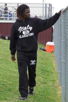 Image: Ryheem Walker gets ready for the long jump with a relaxing stroll to the sand pits.