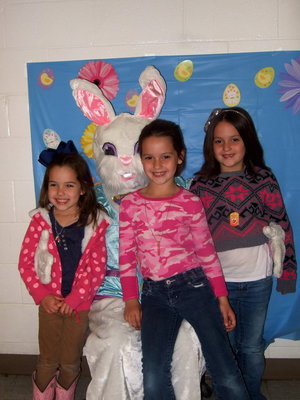 Image: Kendall Hernandez, Kimree Gill and Kaylee Gill posing with the Easter Bunny.