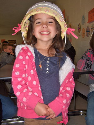 Image: What a cutie, sporting the latest fashion in Easter bonnets!