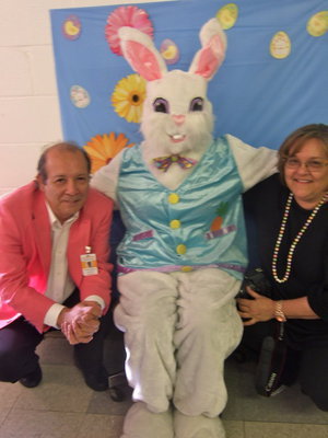 Image: Dr. Del Bosque and Mrs. Del Bosque pose with the Easter Bunny.