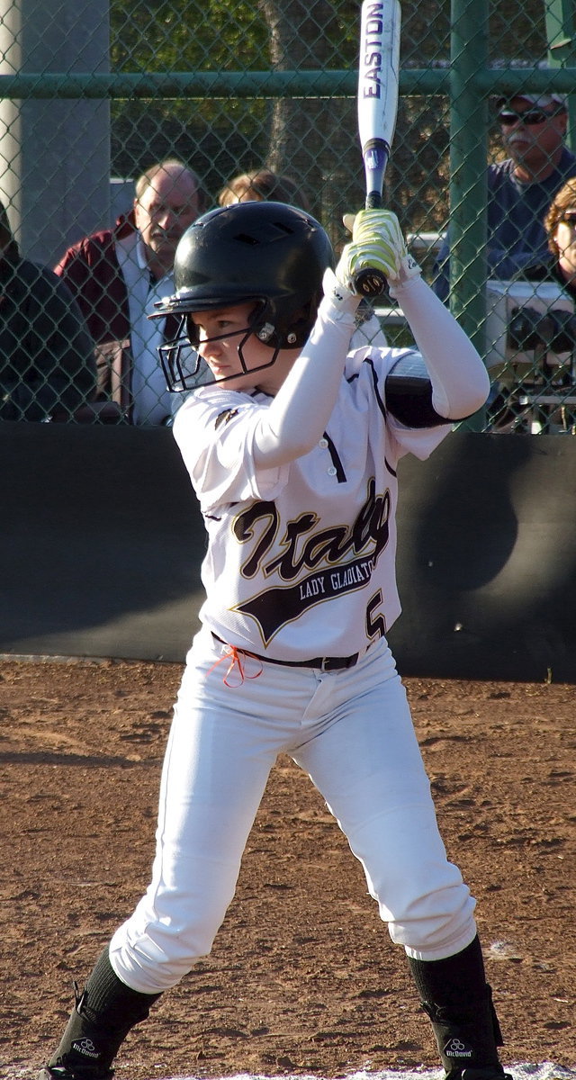 Image: Tara Wallis(5) glares toward the mound as Italy fights to change the course of the game.