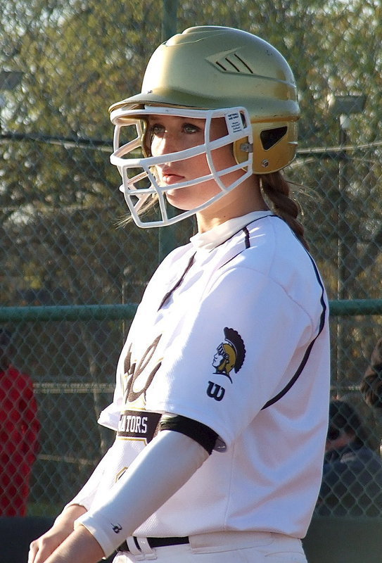 Image: Italy’s Hannah Washington(6) gets the play call before stepping into the batter’s box and then stepping up.