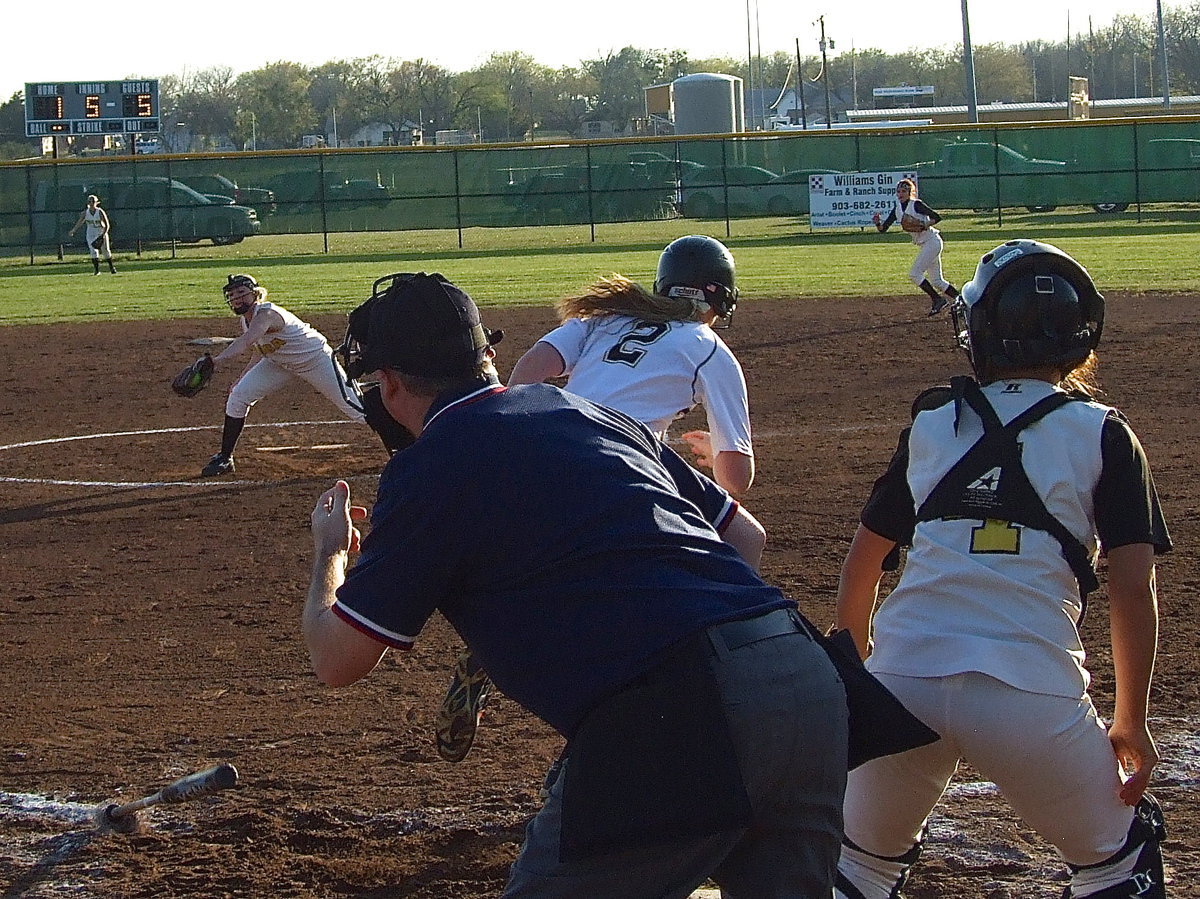 Image: Madison Washington(2) tries to rip one past the pitcher’s mound but Itasca makes the play.