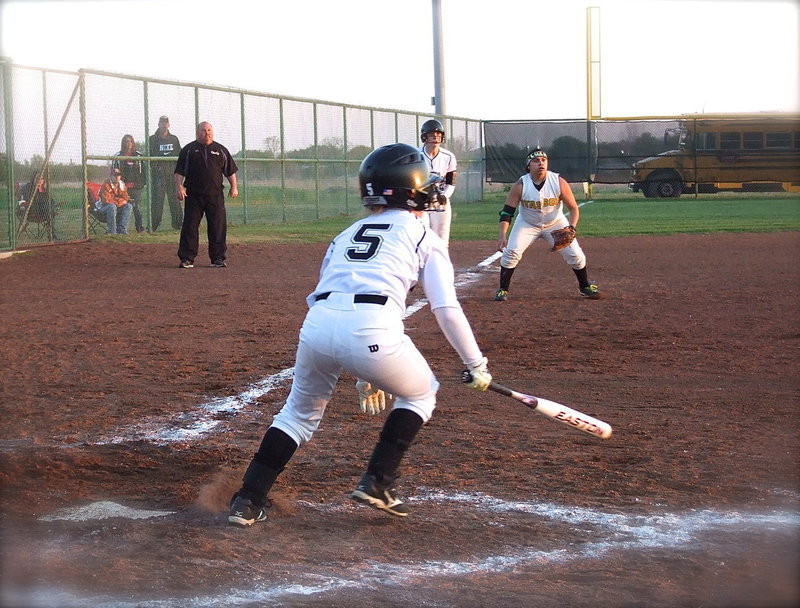 Image: In the bottom of the seventh with the game tied 5-5 with two outs and two strikes, as well as an undefeated district title on the line, Tara Wallis(5) comes thru for the Lady Gladiators with a game defining blooper to score teammate Jaclynn Lewis(15) from third base to win the game for Italy 6-5.