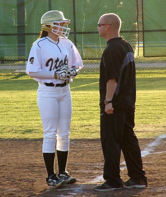 Image: Lillie Perry talks with Lady Gladiator first base coach Michael Chambers.