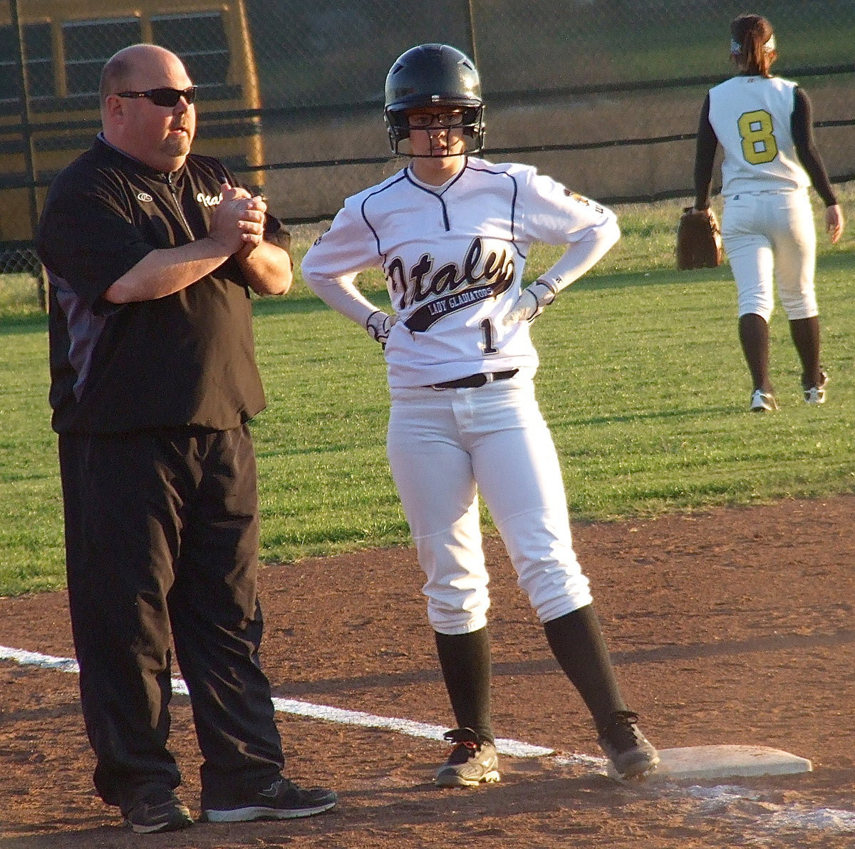 Image: Head coach Wayne Rowe advises Bailey Eubank(1) at third base.