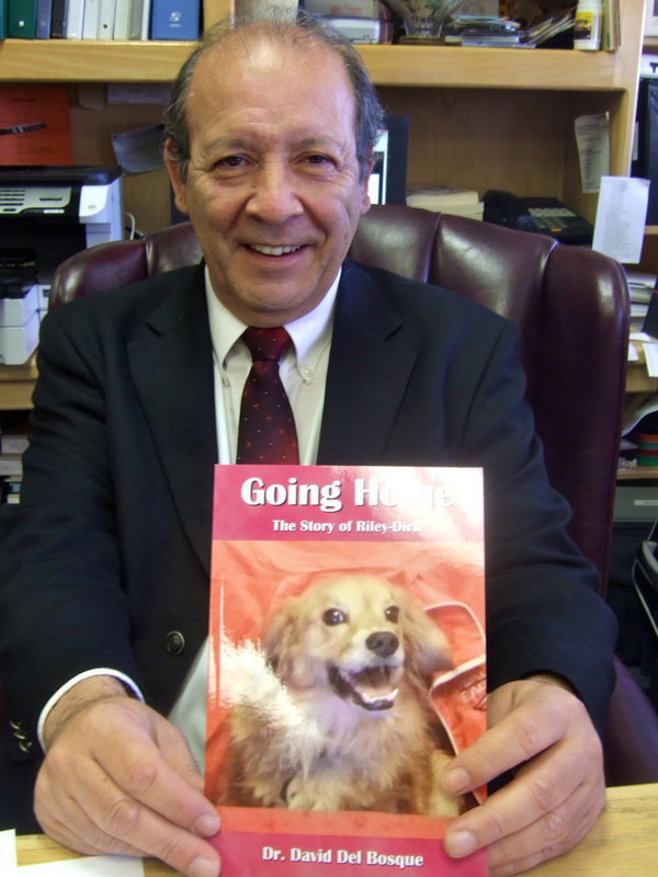 Image: Dr. Del Bosque displaying his book.