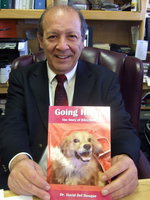 Image: Dr. Del Bosque displaying his book.