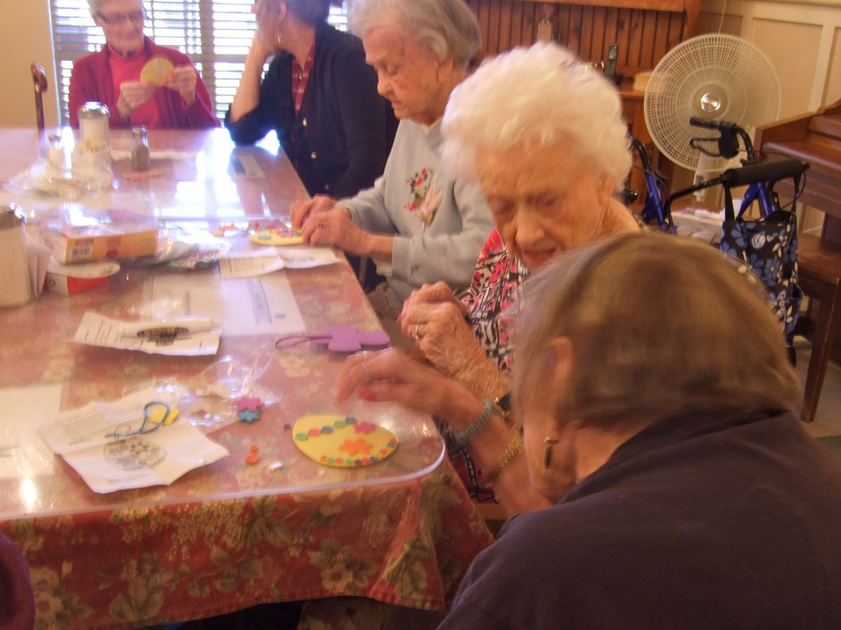 Image: They have their heads together exchanging decoration ideas.