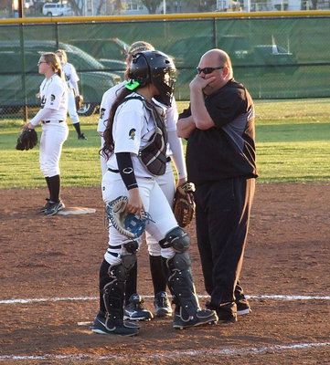 Image: Head coach Wayne Rowe considers trying something different and shares his thoughts with pitcher Jaclynn Lewis and catcher Alyssa Richards. Wanting to stay with the original game plan, Richards’ ended the brief conference by stating, “We got this,” according to Coach Rowe after Italy’s dramatic comeback win.