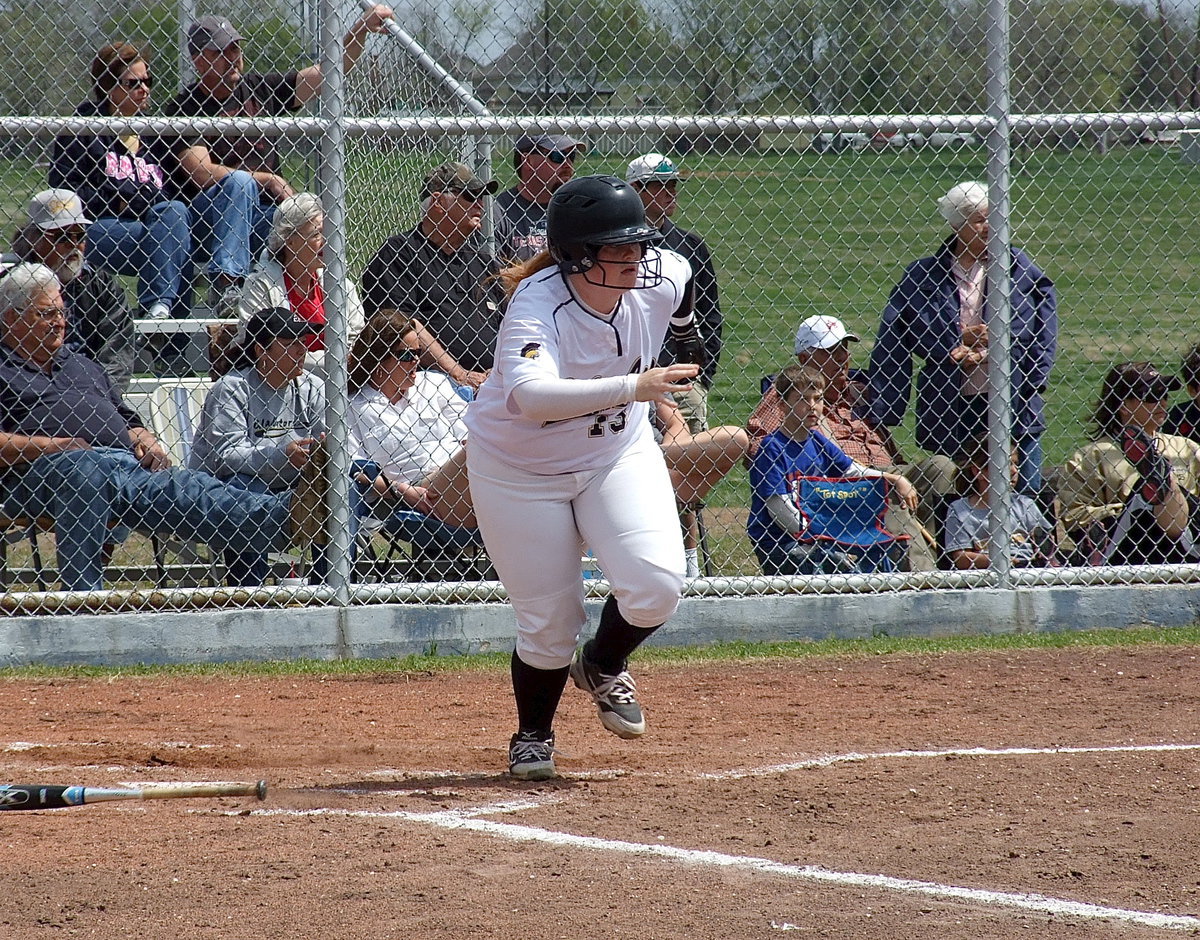 Image: Katie Byers(13) takes off in a sprint after hitting against Frost.