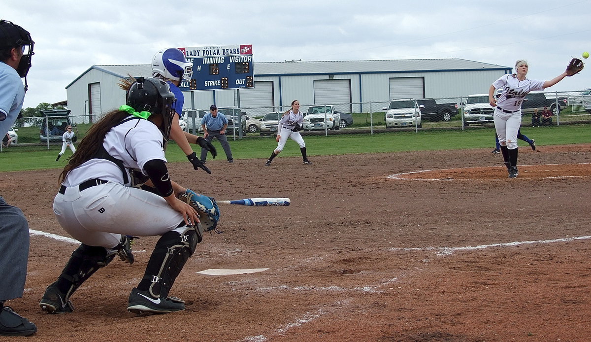 Image: Frost comes from behind to build a 5-3 lead over Italy as pitcher Jaclynn Lewis(15) reaches for a line-drive hit back towards the mound.