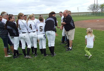 Image: Hannah Rowe hustles up to join the Lady Gladiators in a post-game team prayer.
