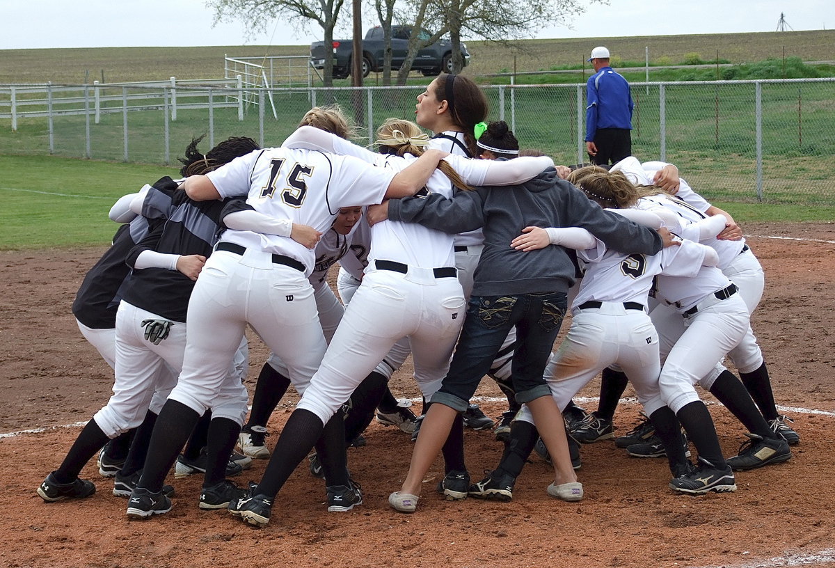 Image: Alyssa Richards and her teammates shout it loud and proud over in Frost after holding on for the 6-5 district win.