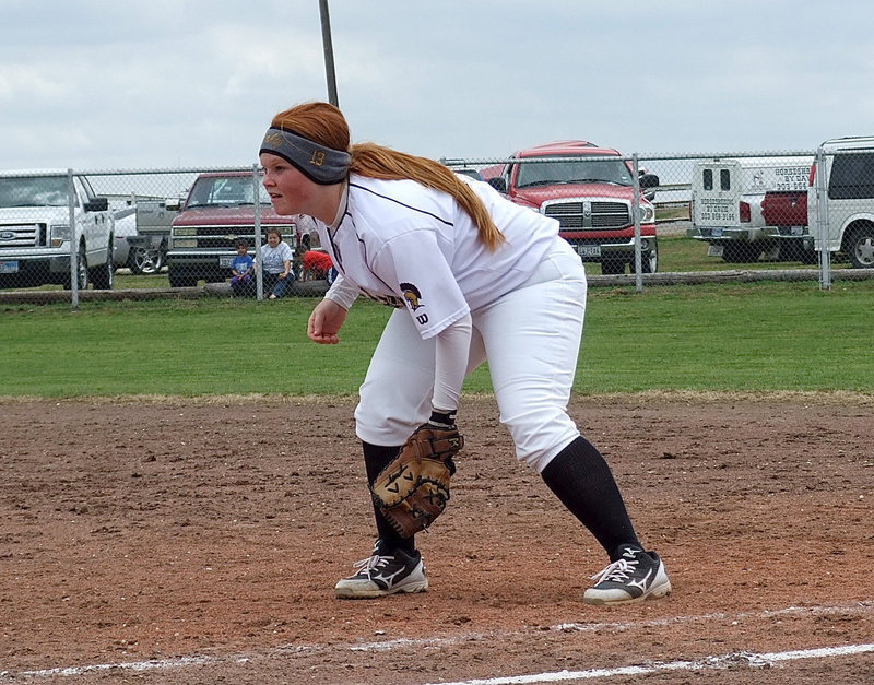 Image: Italy’s first baseman Katie Byers(13) and her fellow defensemen rallied around Lewis to help their pitcher out in a close game against Frost.