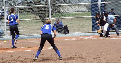 Image: Italy’s Paige Westbrook(10) sends a hit past the mound.