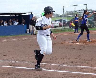 Image: Alyssa RIchards(9) hurries down the first base line after hitting a single.