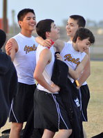 Image: Joseph Celis, Eli Garcia, Dyland McCasland and Blake Brewer celebrate after finishing their team’s relay race.