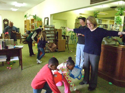 Image: Ms. French sends the children to different areas of the library.