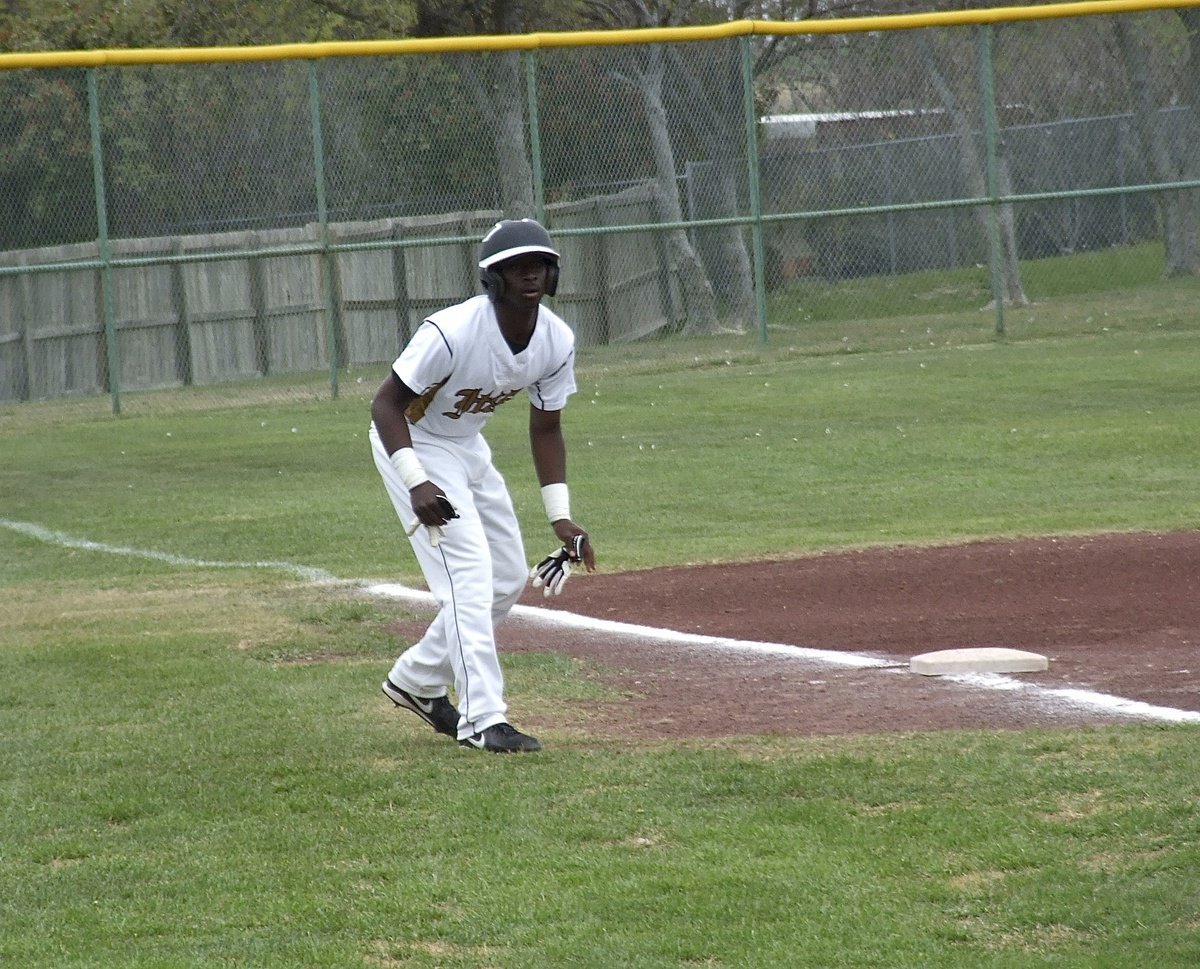 Image: Marvin Cox(3) looks for a chance to steal home.