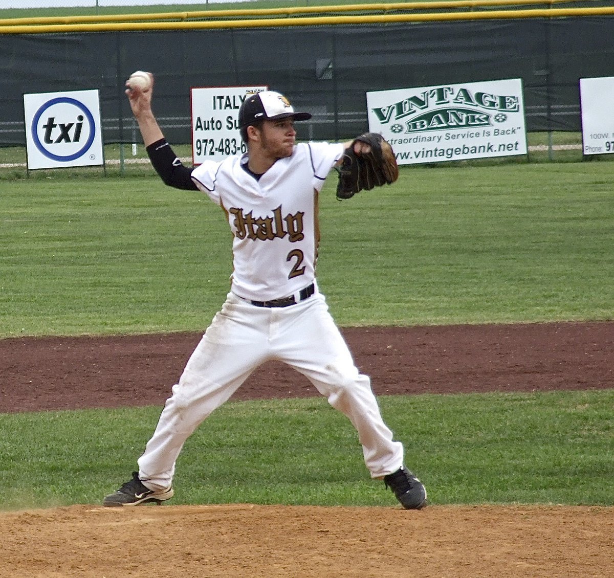 Image: Gladiator pitcher Caden Jacinto(2) tries to pickoff a Frost runner at first base.