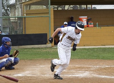 Image: Italy’s Cody Boyd battles his way on to first base with a walk.