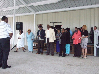 Image: The choir from Union Missionary Baptist Church stands to sing.
