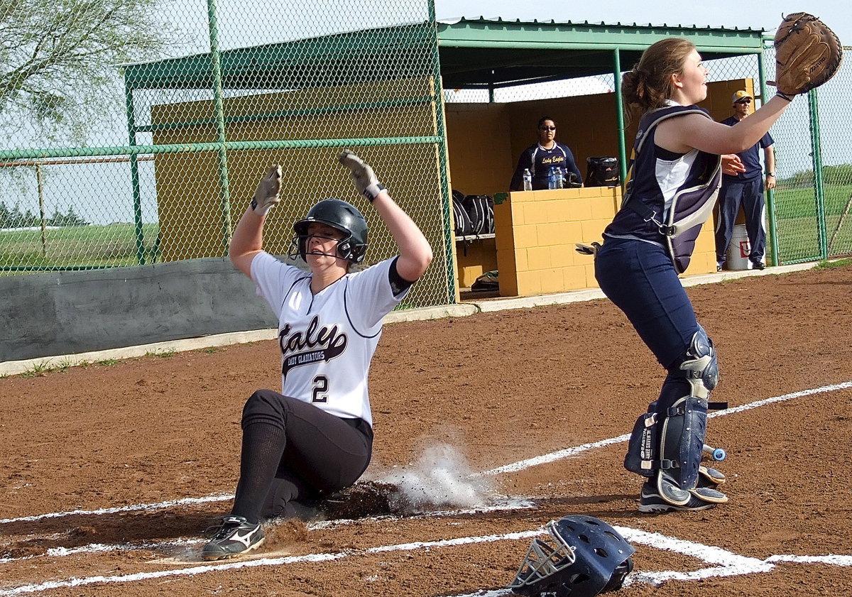 Image: Wwwweeeeeeee!!!! Italy’s Madison Washington(2) slides across home plate during a 13-0 pummeling of Grand Prairie advantage. Look, no hands!!