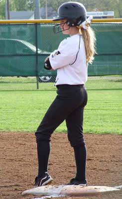 Image: Britney Chambers(4) checks the play call at first base.
