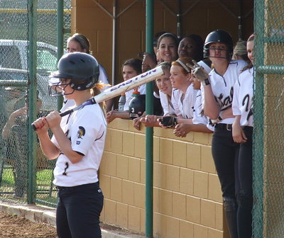 Image: Bailey Eubank(1) tightens the grip on her swing while the dugout is loosey-goosey.