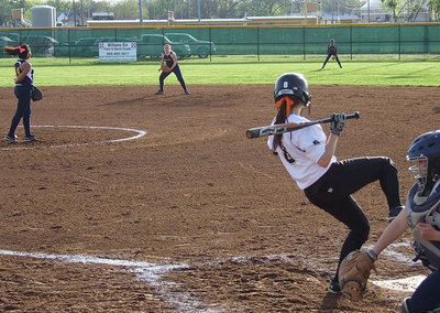 Image: Senior Morgan Cockerham(8) tries to avoid a bad pitch but gets to take her base.