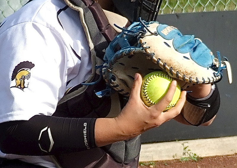 Image: The mitt, the grip and the arm of catcher Alyssa Richards.