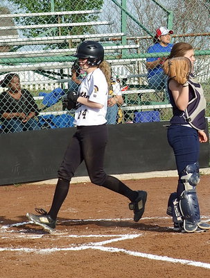 Image: Kelsey Nelson(14) reaches home plate for an Italy run.
