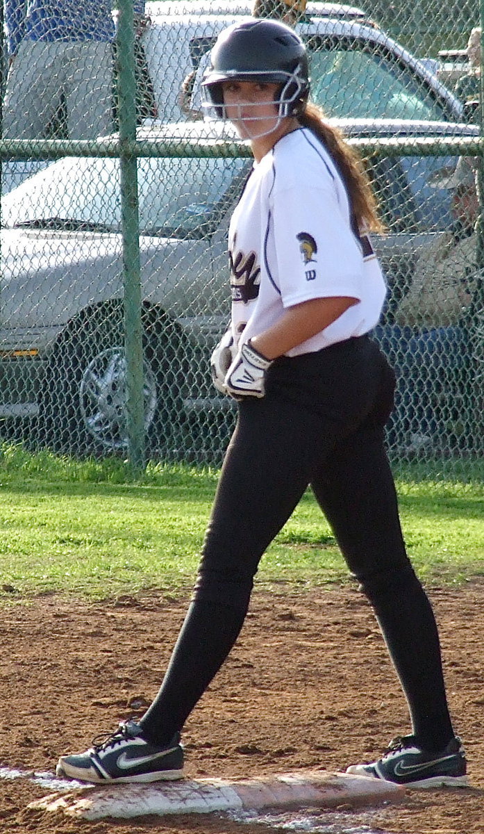 Image: Freshman Lillie Perry(12) is ready to run as she settles in at first base.