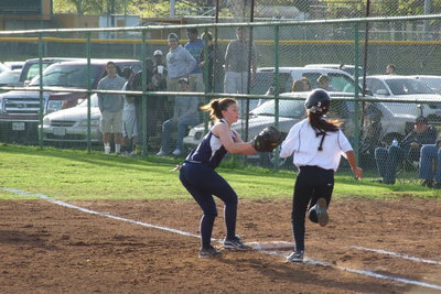 Image: A hustling Ashlyn Jacinto(7) is tagged before reaching first base in a rare stop for the Lady Eagles.