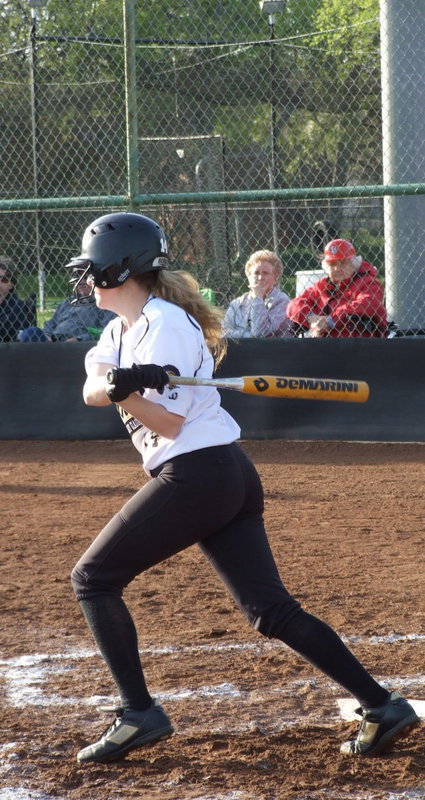 Image: Lady Gladiator fans Joy Moneyhon and her mom Alice Riddle observe the action as Kelsey Nelson(14) hits the ball into play.