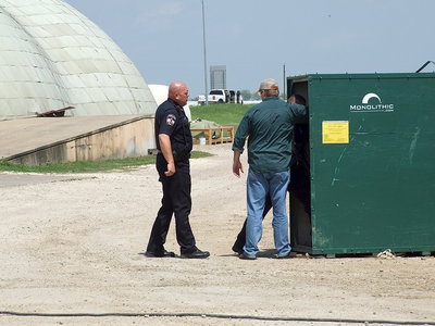 Image: Mike South allows entry into a dome construction area to Italy Police Chief Diron Hill and Milford Police Chief Carlos Phoenix who take a look inside.