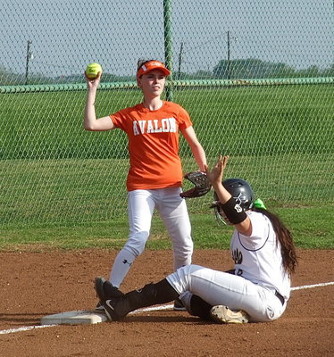 Image: Sliding into third base safely is Italy’s Alyssa Richards(9) who wisely calls for a timeout.