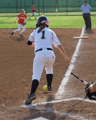 Image: Bailey Eubank(1) tries to reach first base without her hit bouncing foul.