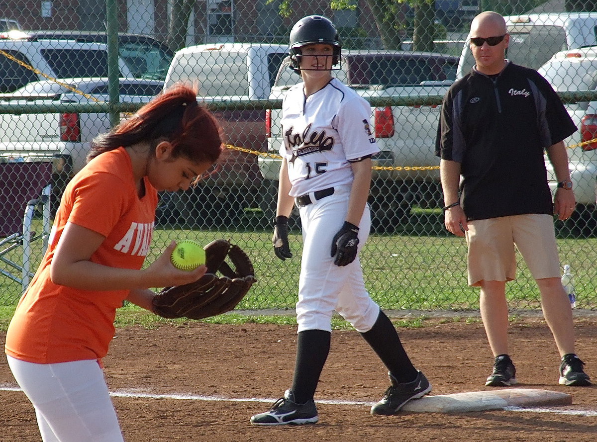 Image: Jaclynn Lewis(15) is ready to run with Coach Michael Chambers ready to yell, “Go!”