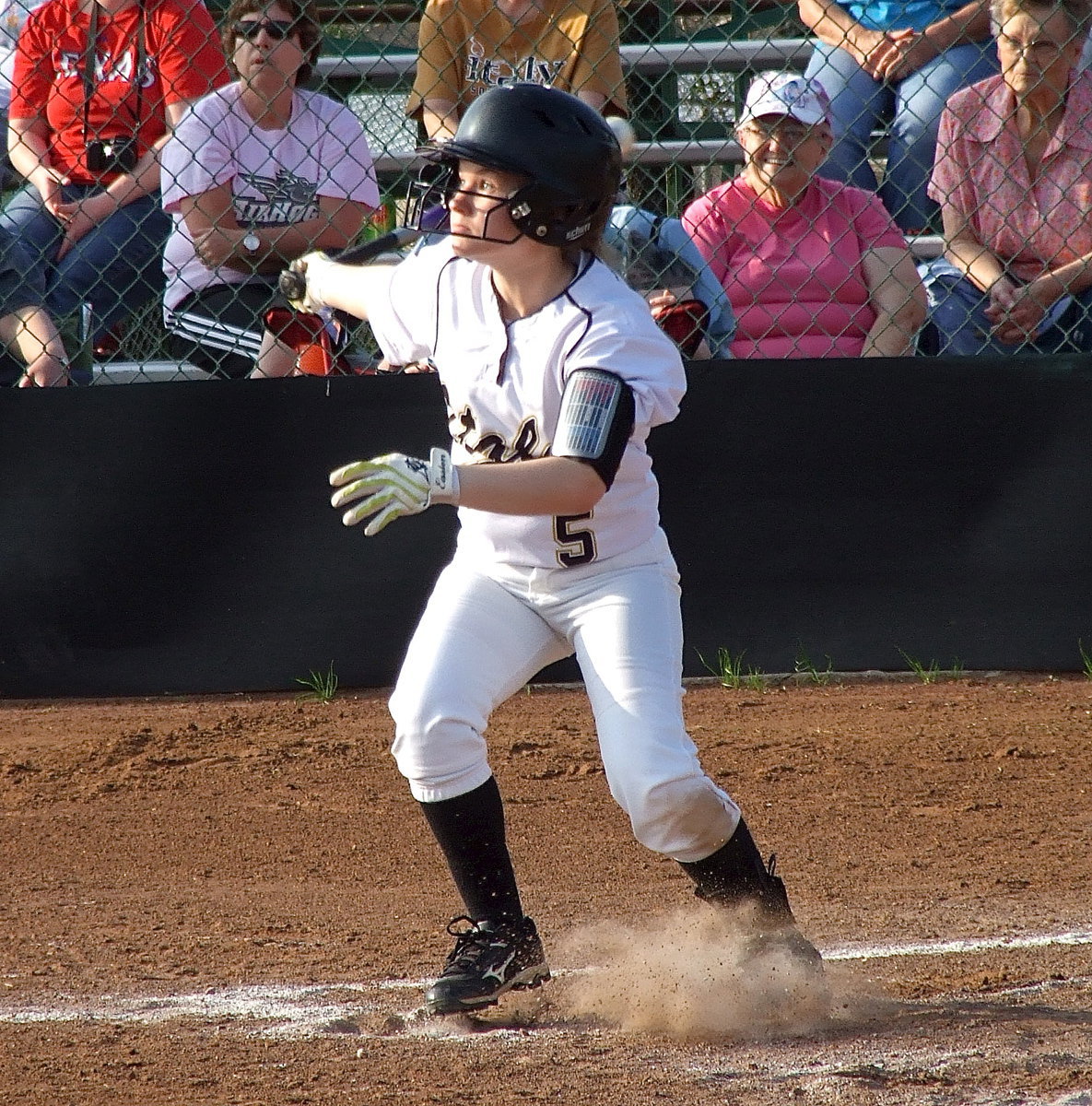 Image: Tara Wallis(5) stirs up some sand against Avalon with Italy getting the 16-0 win in just two-and-a-half innings of play.